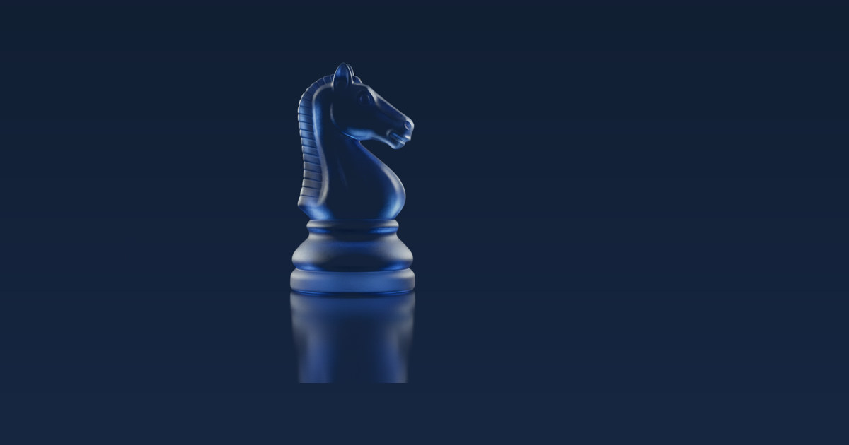 Close-up of a glass knight chess piece on a dark background – a moment of reflection before the first move.